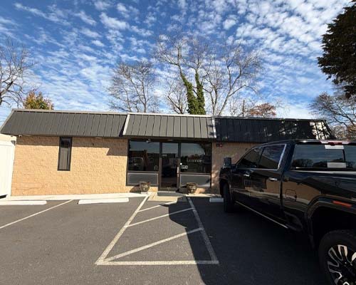 Commercial roof with truck out front